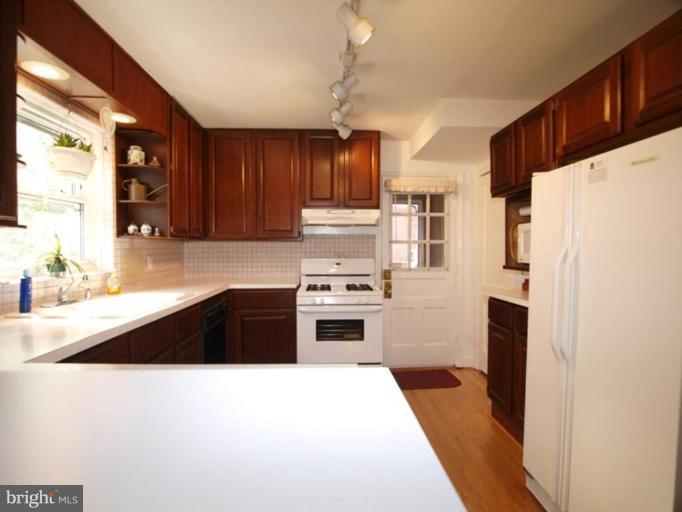 2600 Dawson Avenue Silver Spring, MD 20902 - Photo 15 of 24 a kitchen with granite countertop a refrigerator stove and sink