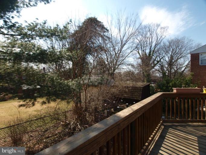 2600 Dawson Avenue Silver Spring, MD 20902 - Photo 18 of 24 a balcony with wooden floor and yard in the back