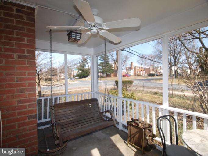 2600 Dawson Avenue Silver Spring, MD 20902 - Photo 6 of 24 a view of a porch with a table and chairs