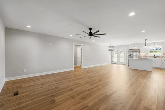 a view of a kitchen with a sink and a window
