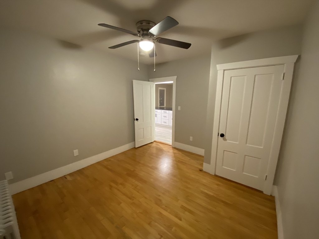 91 Main, Unit 2W Easton, MA 02356 - Photo 6 of 8 wooden floor in an empty room