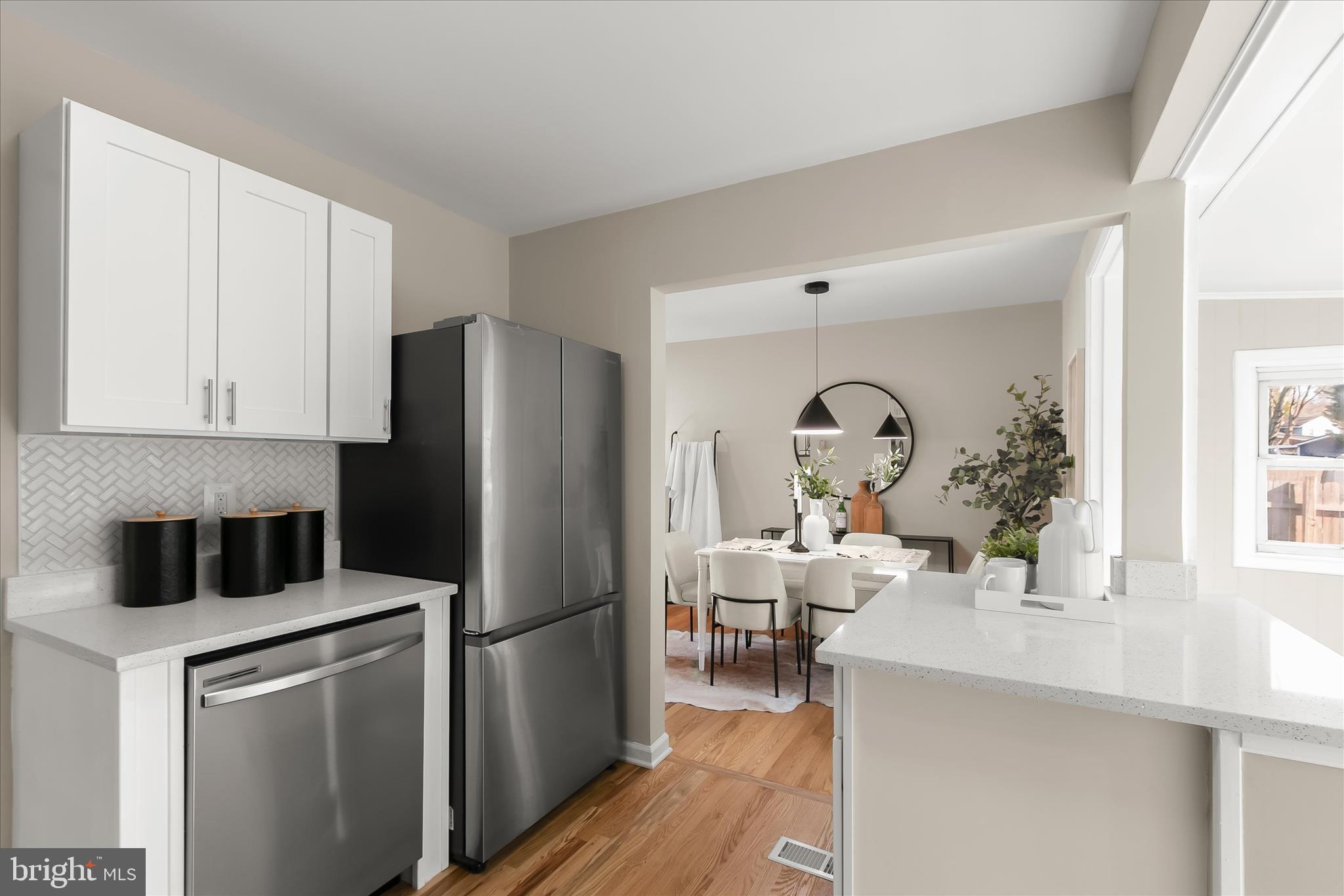 13218 Holdridge Road Silver Spring, MD 20906 - Photo 14 of 51 a kitchen with a refrigerator and a sink