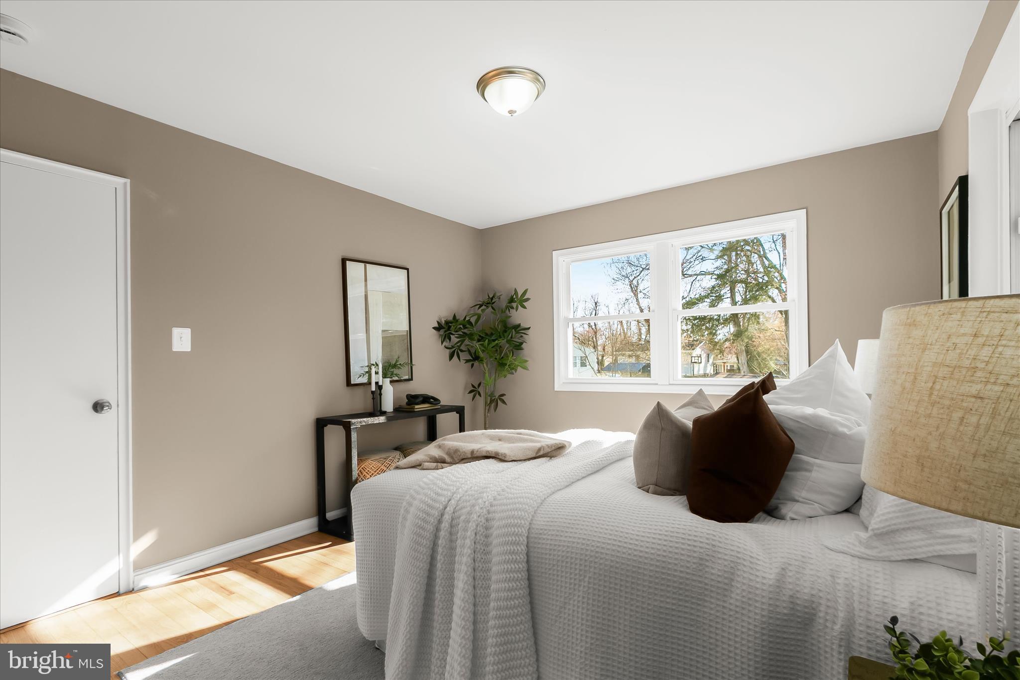 13218 Holdridge Road Silver Spring, MD 20906 - Photo 22 of 51 a bedroom with a bed and a large window