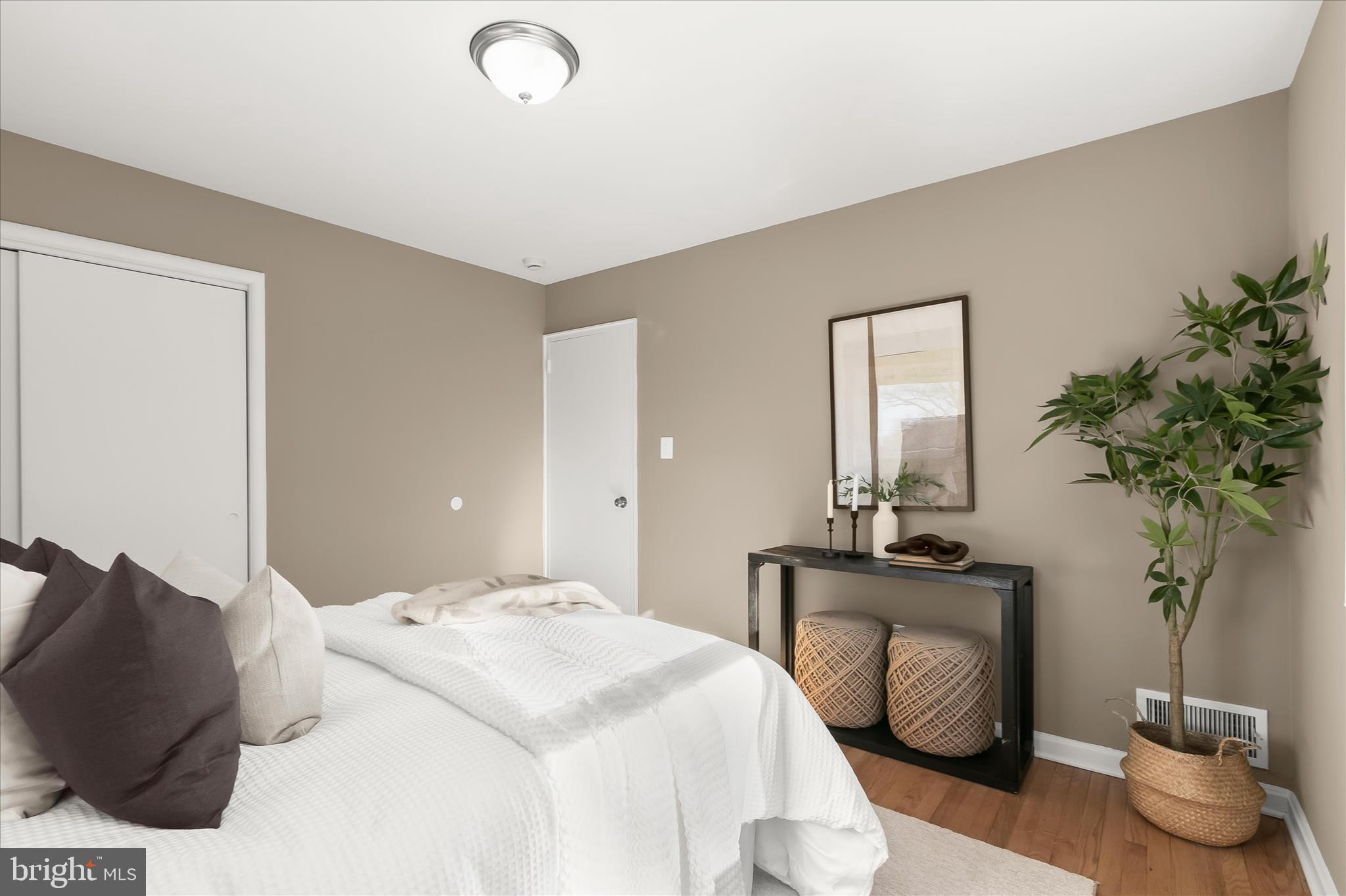13218 Holdridge Road Silver Spring, MD 20906 - Photo 23 of 51 a bedroom with a bed and a potted plant