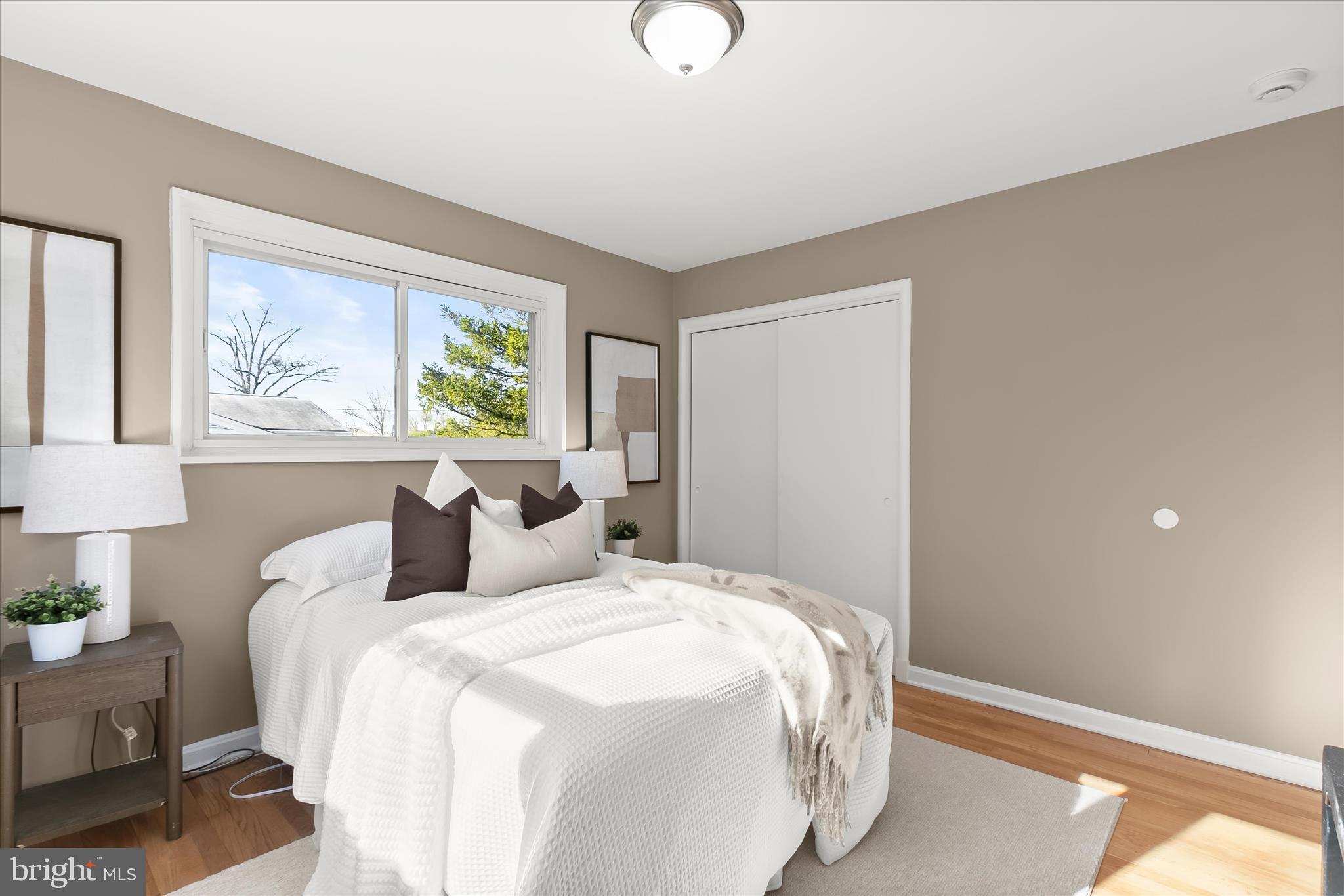 13218 Holdridge Road Silver Spring, MD 20906 - Photo 24 of 51 a bedroom with a large bed and a window