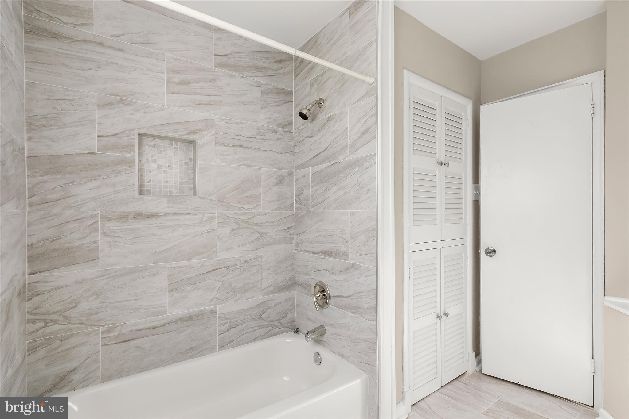 13218 Holdridge Road Silver Spring, MD 20906 - Photo 27 of 51 a bathroom with a bathtub