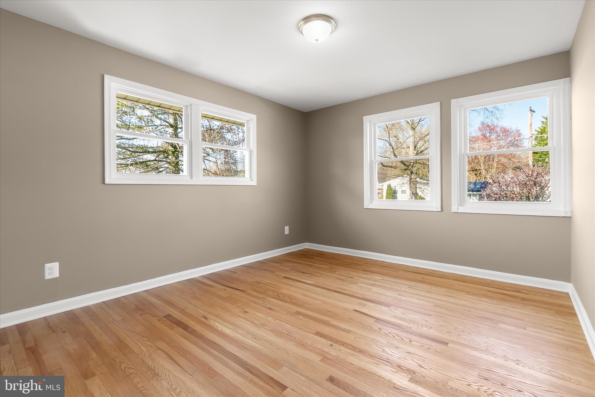 13218 Holdridge Road Silver Spring, MD 20906 - Photo 29 of 51 a view of room with window and wooden floor
