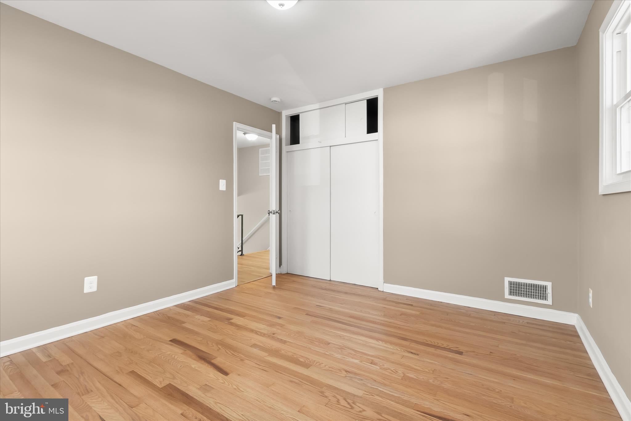 13218 Holdridge Road Silver Spring, MD 20906 - Photo 30 of 51 a view of an empty room with wooden floor