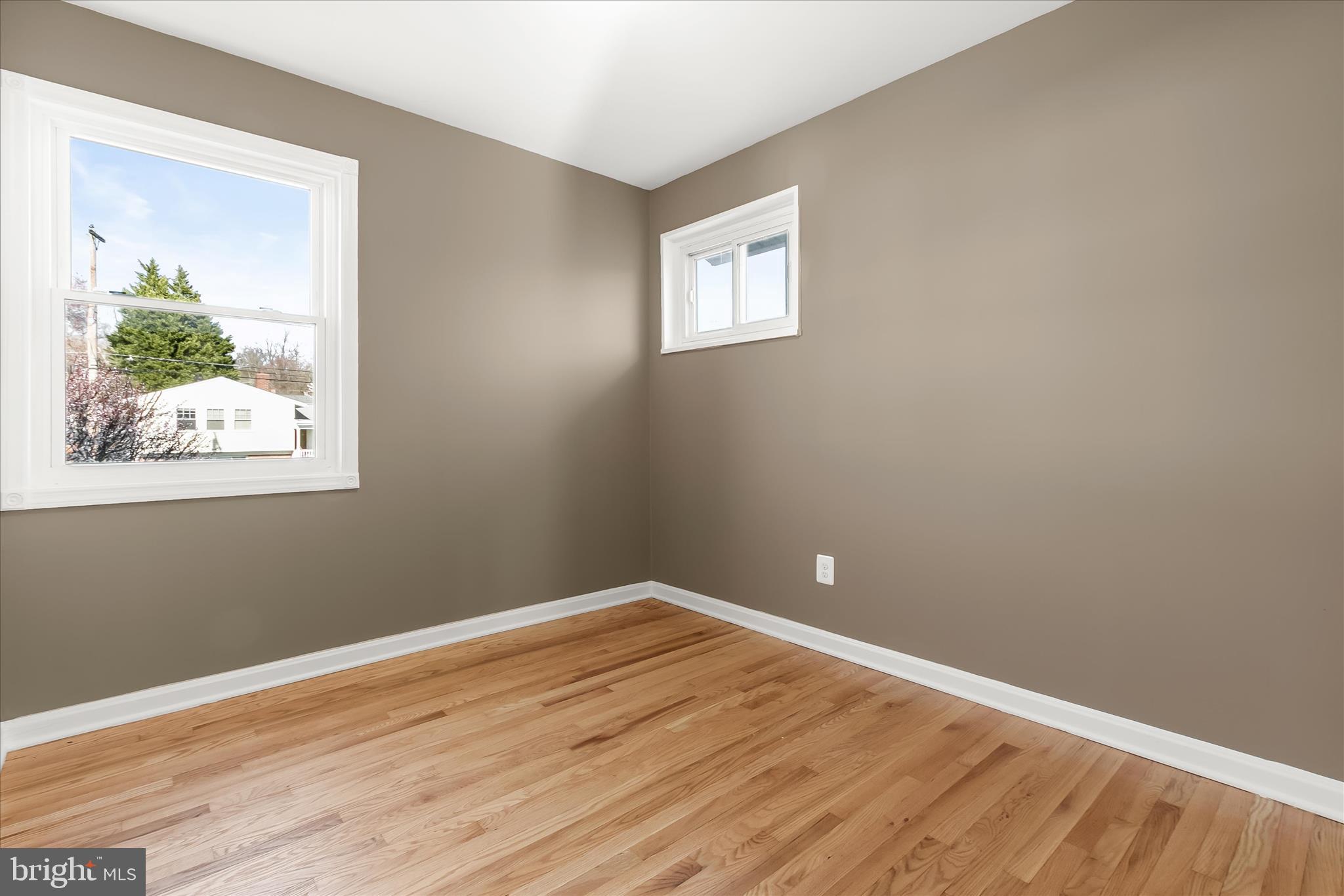 13218 Holdridge Road Silver Spring, MD 20906 - Photo 31 of 51 a view of a small space with wooden floor and a window