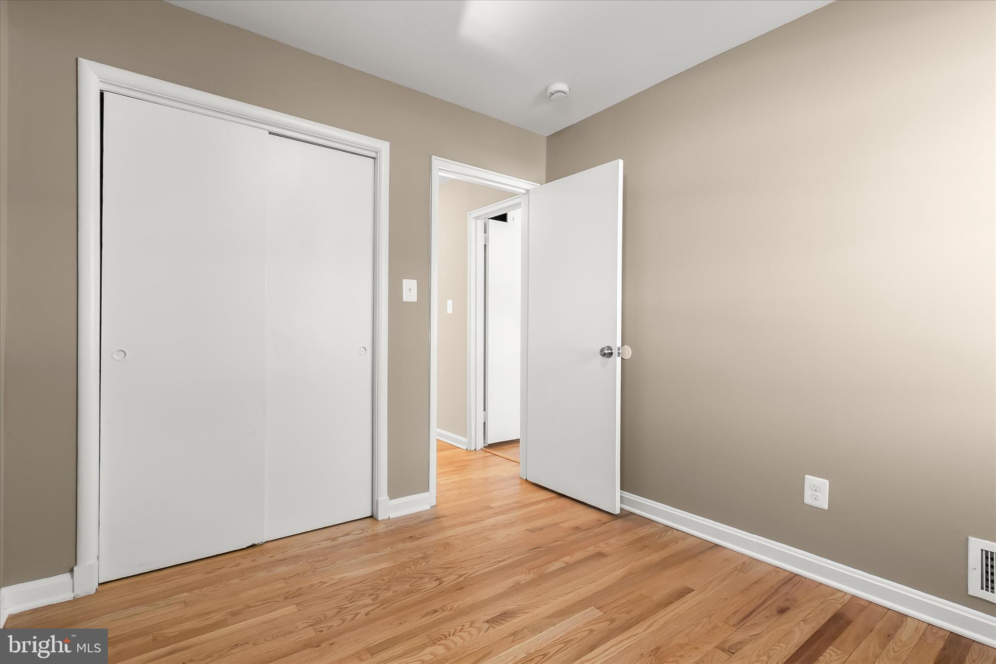 13218 Holdridge Road Silver Spring, MD 20906 - Photo 32 of 51 a view of an empty room with wooden floor