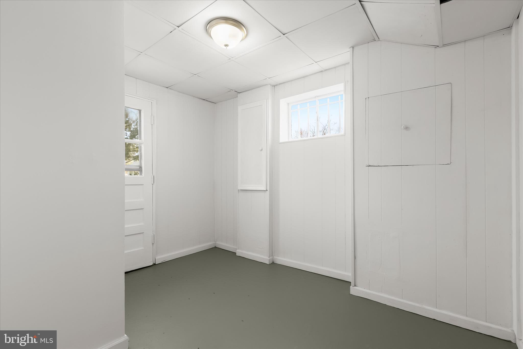 13218 Holdridge Road Silver Spring, MD 20906 - Photo 41 of 51 an empty room with windows
