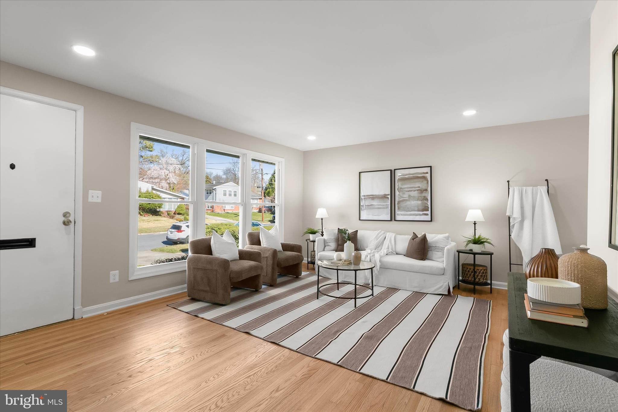 13218 Holdridge Road Silver Spring, MD 20906 - Photo 6 of 51 a living room with furniture and a large window