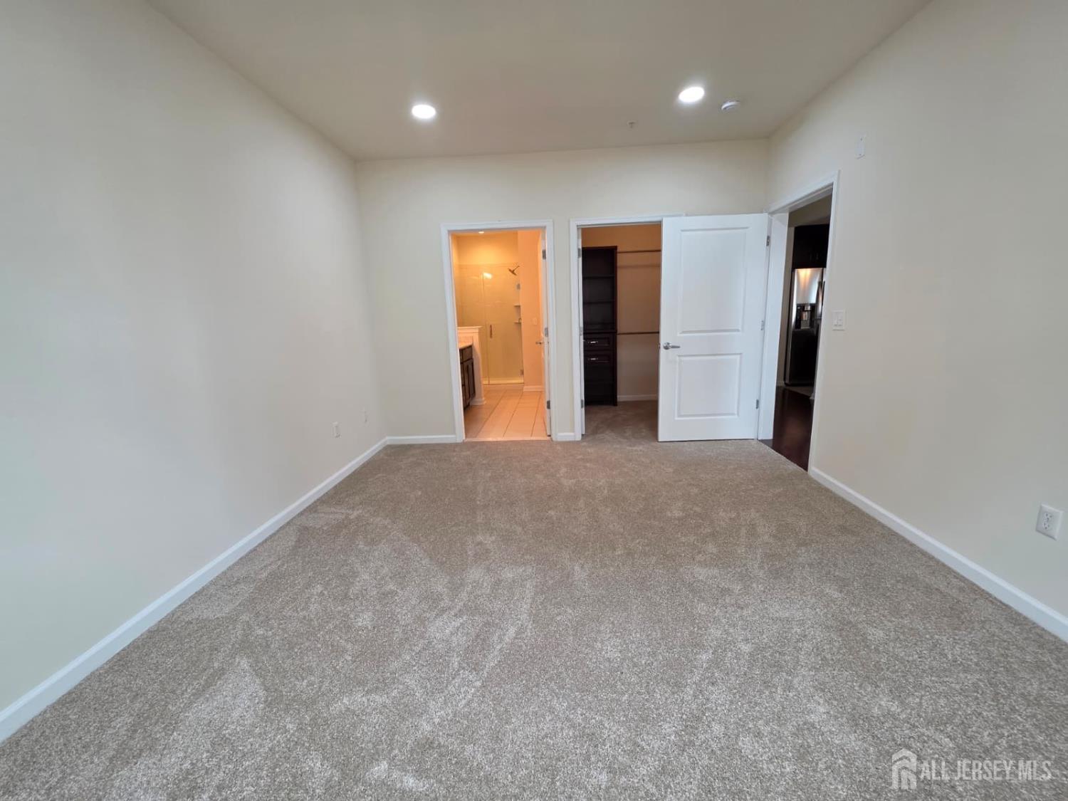 631 Strassle Way South Plainfield, NJ 07080 - Photo 18 of 34 a view of an empty room with wooden floor and entryway
