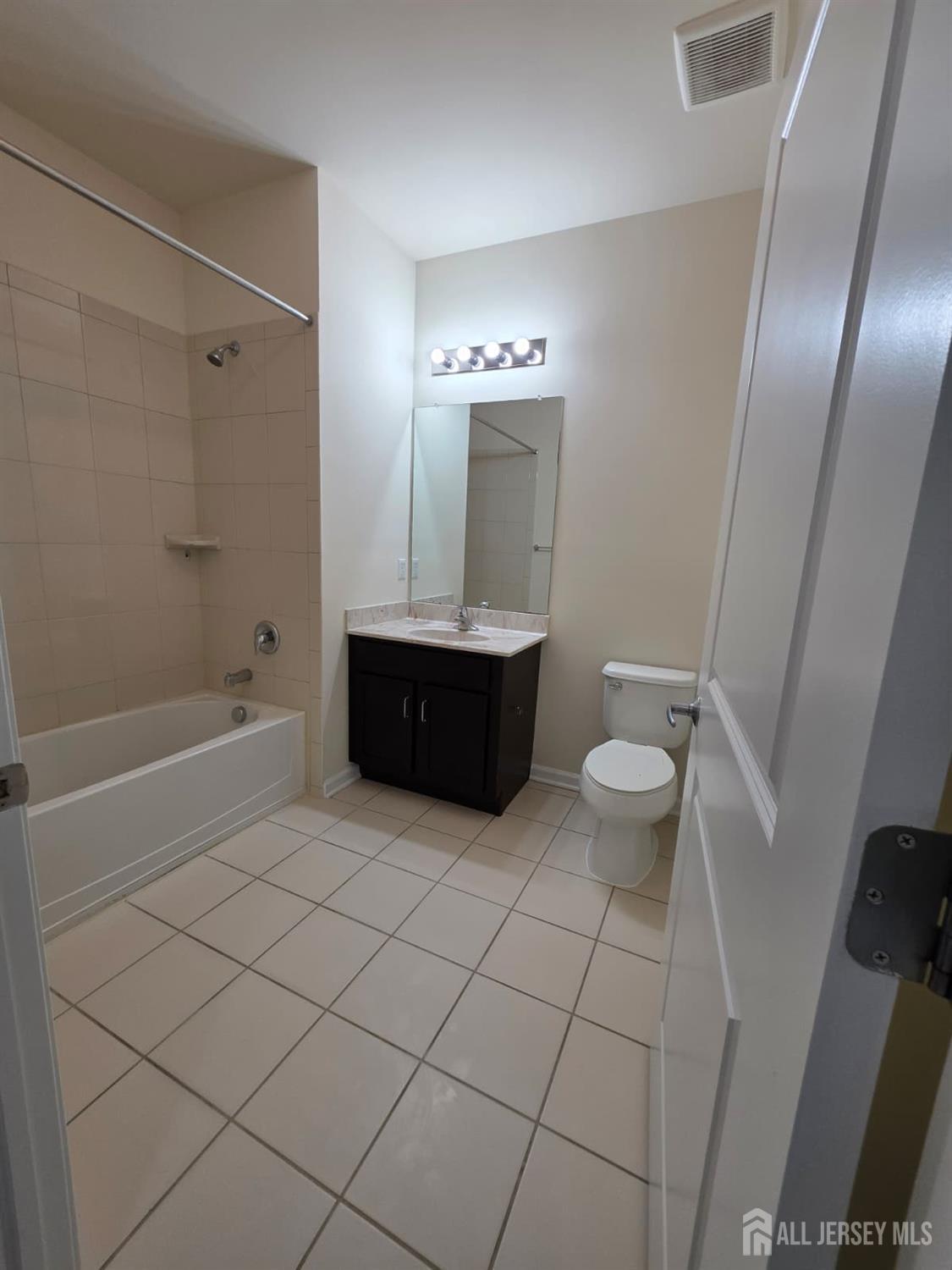 631 Strassle Way South Plainfield, NJ 07080 - Photo 20 of 34 a bathroom with a sink and a mirror