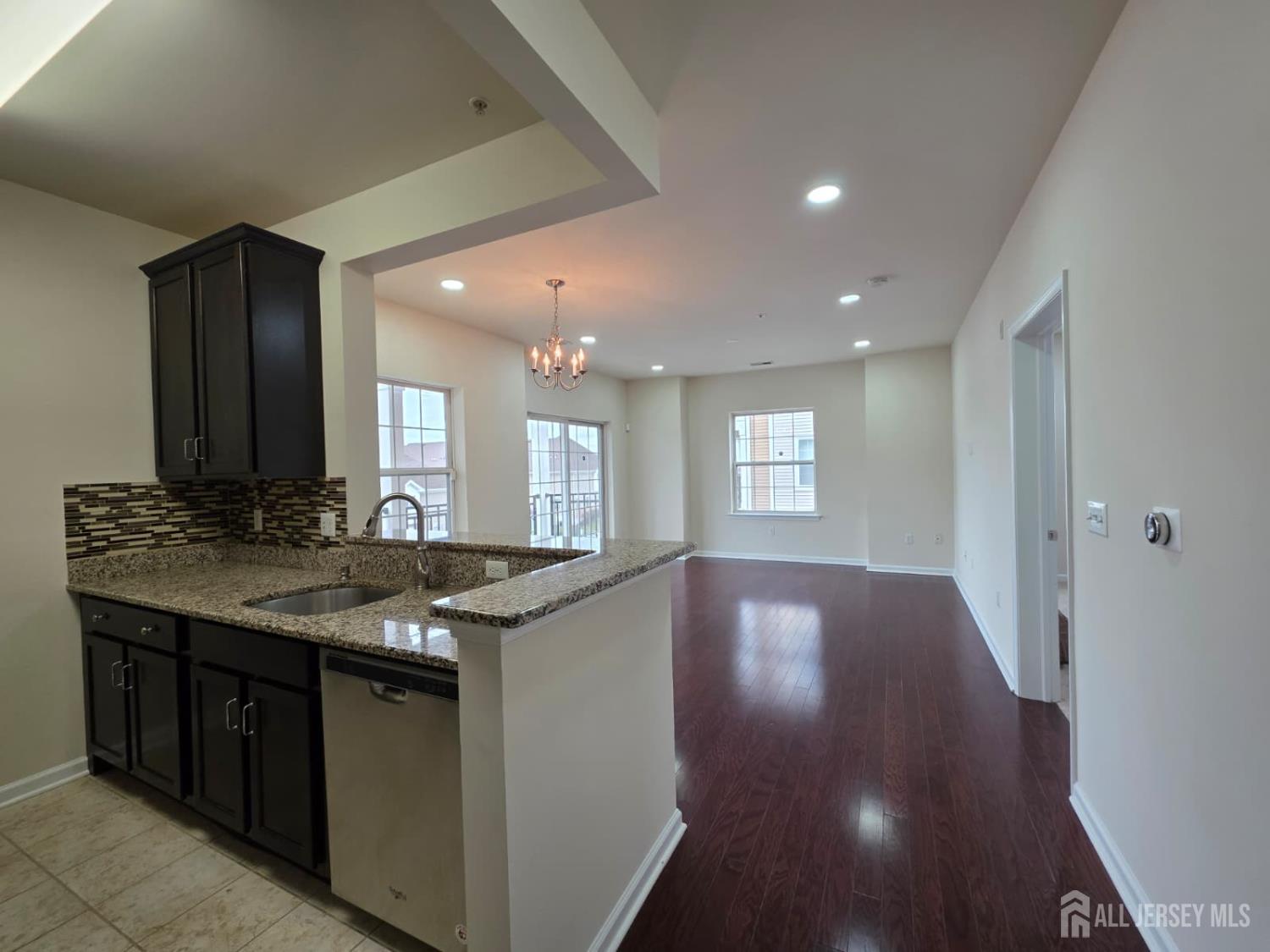 631 Strassle Way South Plainfield, NJ 07080 - Photo 2 of 34 a kitchen with granite countertop a sink and cabinets
