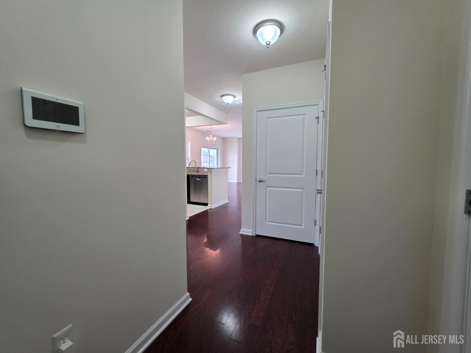 631 Strassle Way South Plainfield, NJ 07080 - Photo 21 of 34 an empty room with wooden floor and windows