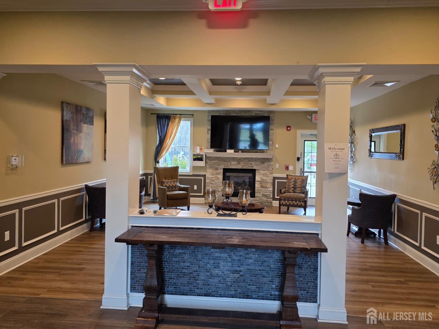 631 Strassle Way South Plainfield, NJ 07080 - Photo 24 of 34 a living room with furniture a flat screen tv and kitchen view
