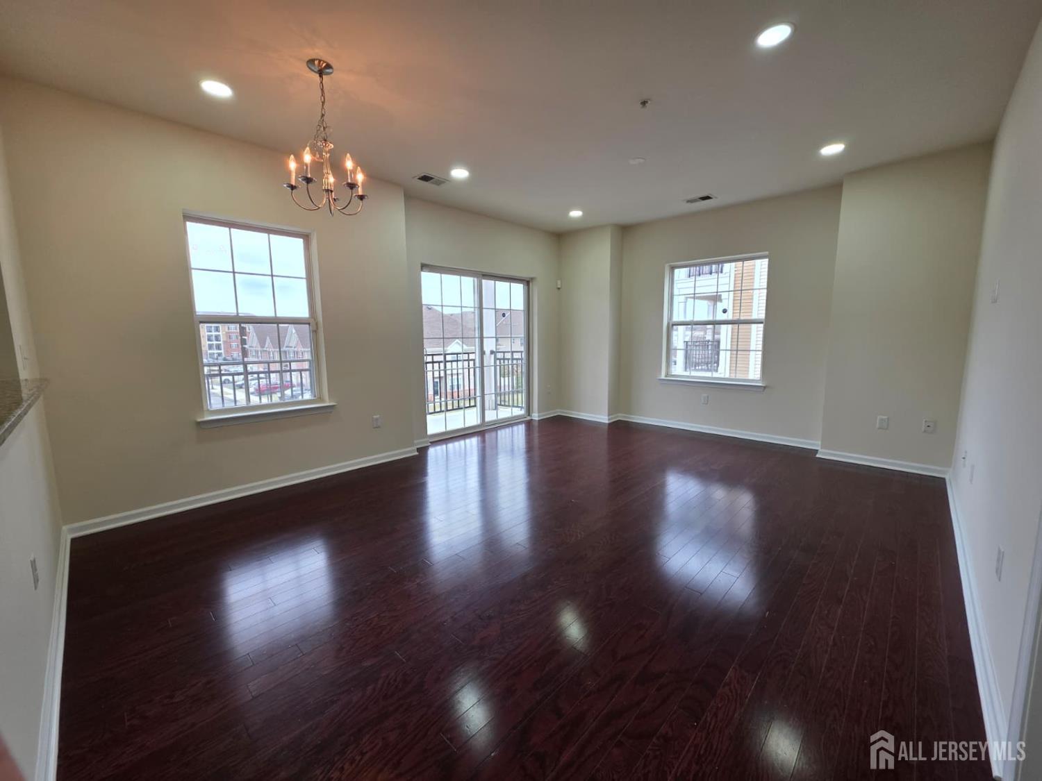 631 Strassle Way South Plainfield, NJ 07080 - Photo 5 of 34 a view of an empty room with wooden floor and a window