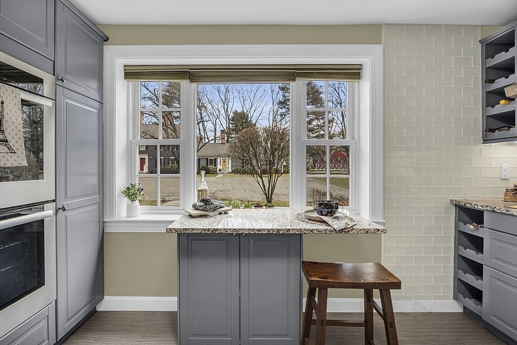 64 Jericho Road, Unit 64 Weston, MA 02493 - Photo 14 of 26 a dining table chair next to a window