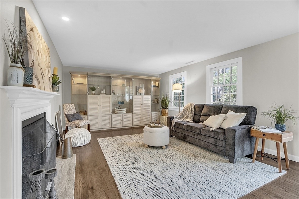 64 Jericho Road, Unit 64 Weston, MA 02493 - Photo 17 of 26 a living room with furniture and a fireplace