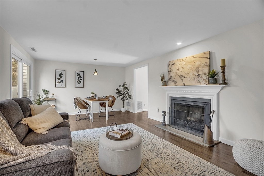 64 Jericho Road, Unit 64 Weston, MA 02493 - Photo 20 of 26 a living room with furniture and a fireplace