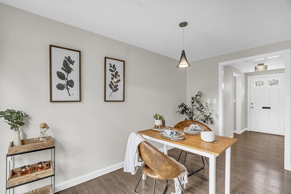 64 Jericho Road, Unit 64 Weston, MA 02493 - Photo 22 of 26 a view of a dining room with furniture and wooden floor