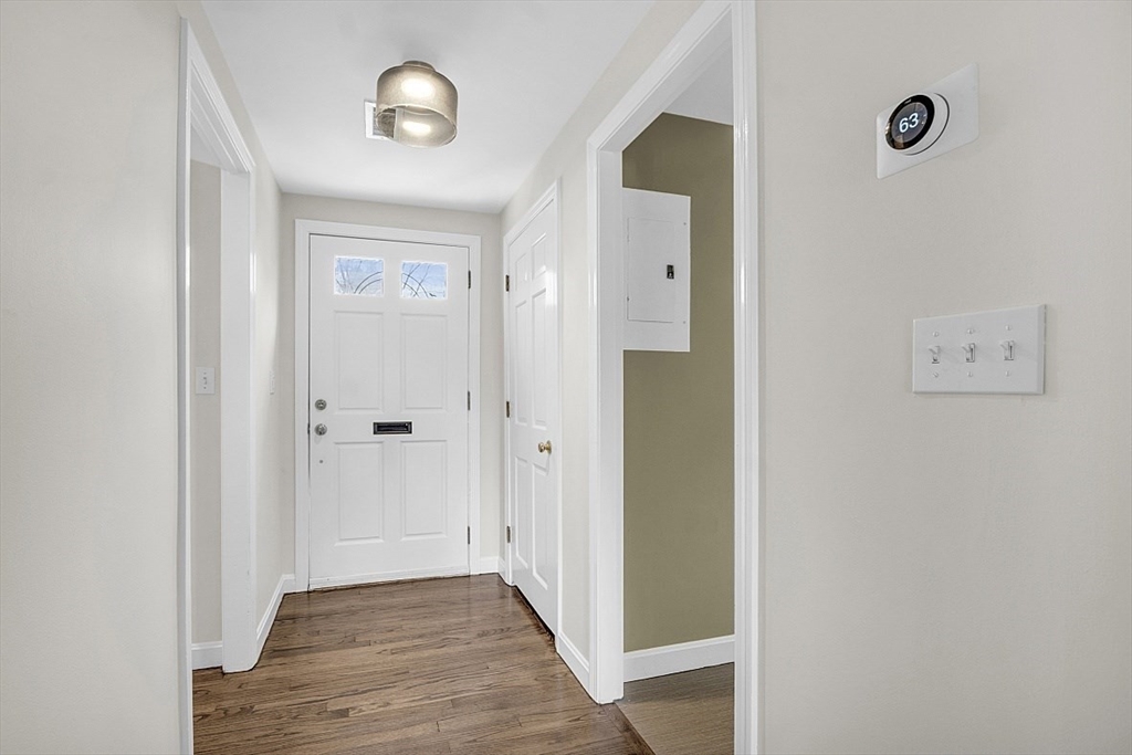 64 Jericho Road, Unit 64 Weston, MA 02493 - Photo 23 of 26 a view of a hallway with wooden floor