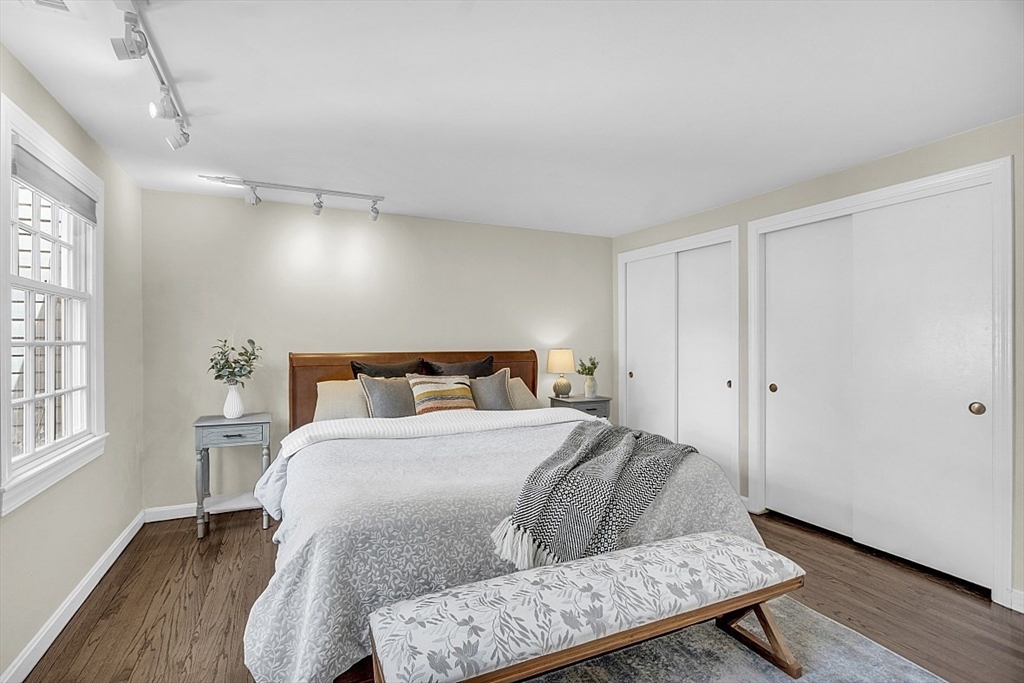 64 Jericho Road, Unit 64 Weston, MA 02493 - Photo 6 of 26 a bedroom with a bed and wooden floor