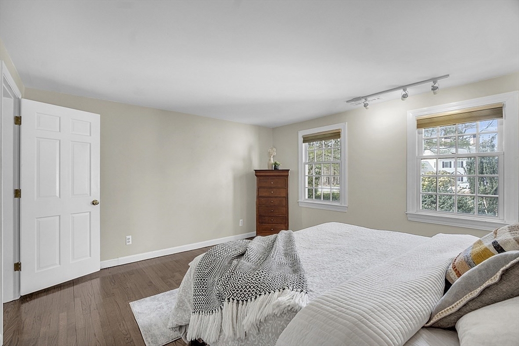 64 Jericho Road, Unit 64 Weston, MA 02493 - Photo 7 of 26 a bedroom with a bed and wooden floor