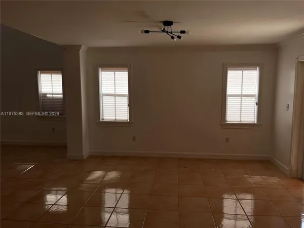a view of an empty room and window