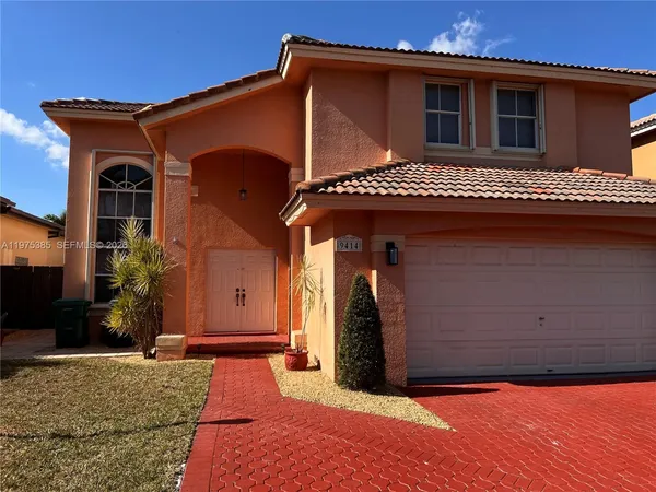a front view of a house with a garage
