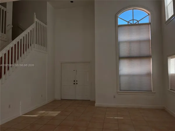 a view of balcony with floor to ceiling fan