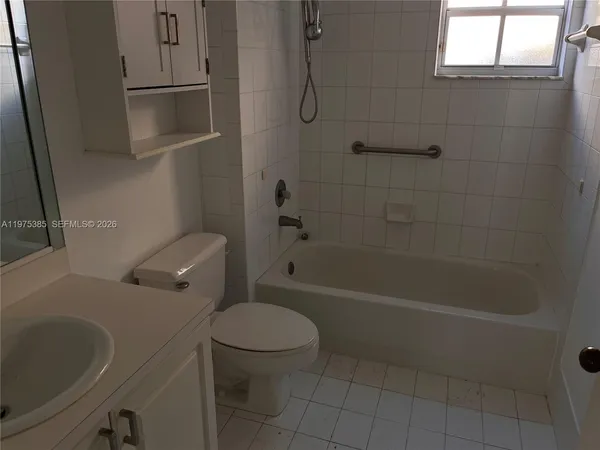 a bathroom with a toilet and a bathtub