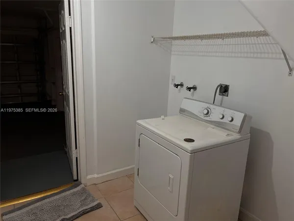 an empty room with closet area