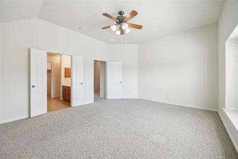 a view of a livingroom with a chandelier fan