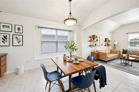 a view of a dining room with furniture