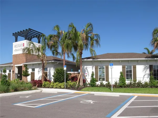 a front view of a house with a garden and a garage