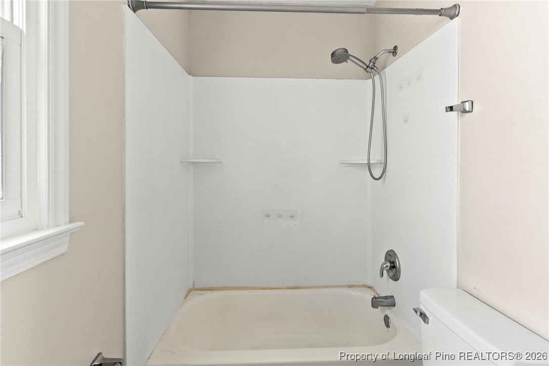 5196 Remington Road Fayetteville, NC 28311 - Photo 20 of 34 a bathroom with a bath tub with a shower