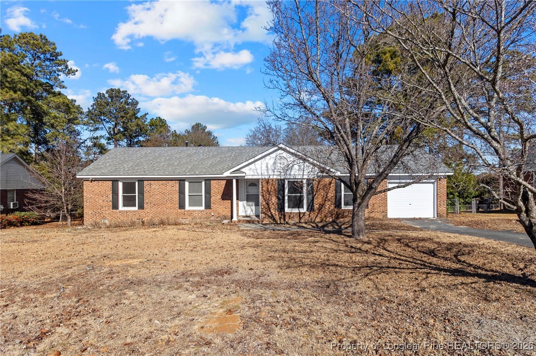 5196 Remington Road Fayetteville, NC 28311 - Photo 2 of 34 a front view of a house with a yard