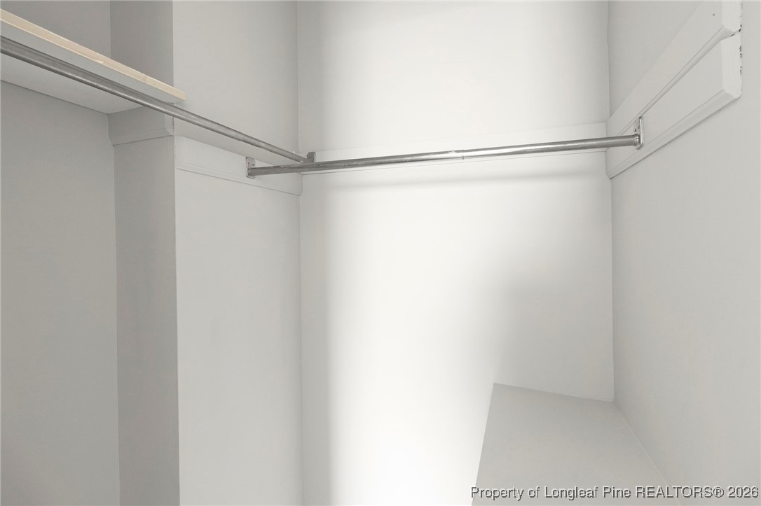 5196 Remington Road Fayetteville, NC 28311 - Photo 21 of 34 a bathroom with a glass shower door
