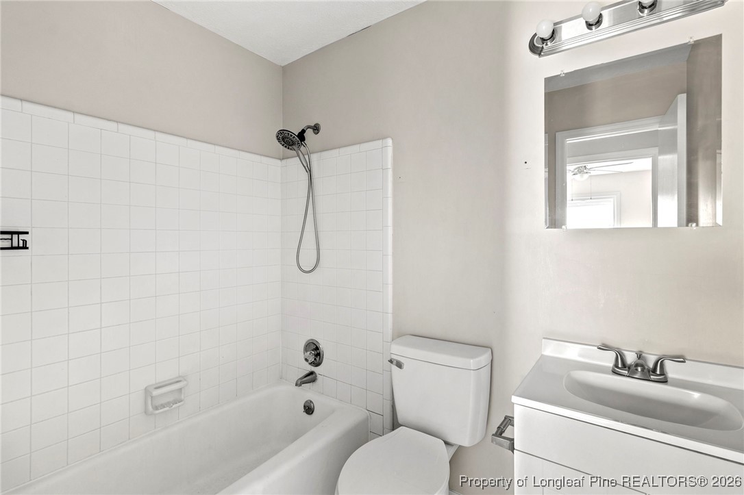 5196 Remington Road Fayetteville, NC 28311 - Photo 24 of 34 a bathroom with a sink toilet and shower