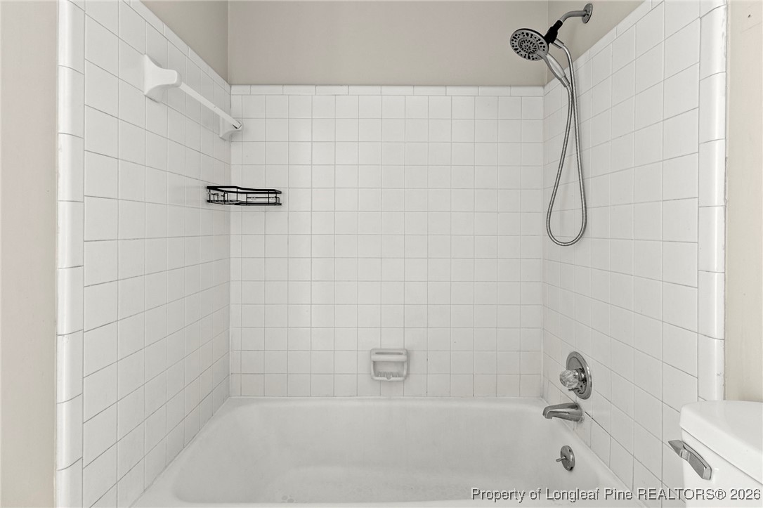 5196 Remington Road Fayetteville, NC 28311 - Photo 25 of 34 a bathroom with a bath tub with a shower