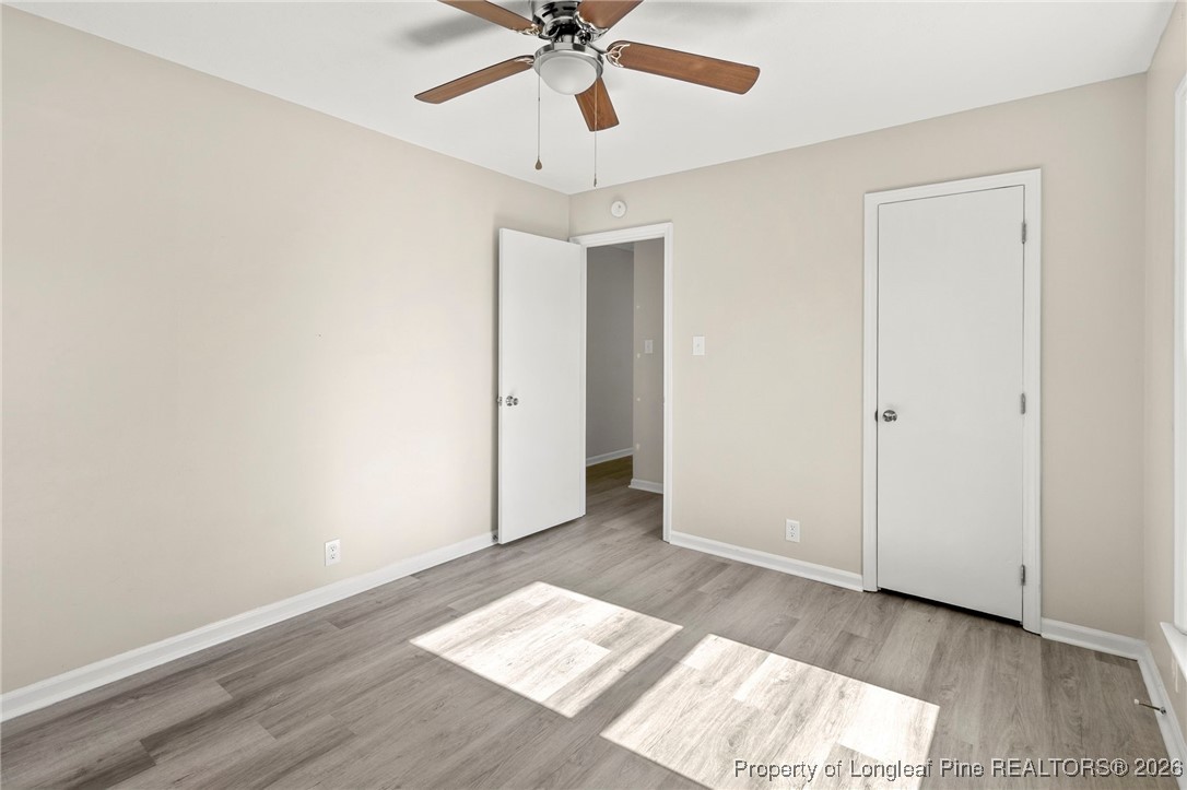 5196 Remington Road Fayetteville, NC 28311 - Photo 27 of 34 wooden floor in an empty room with a window