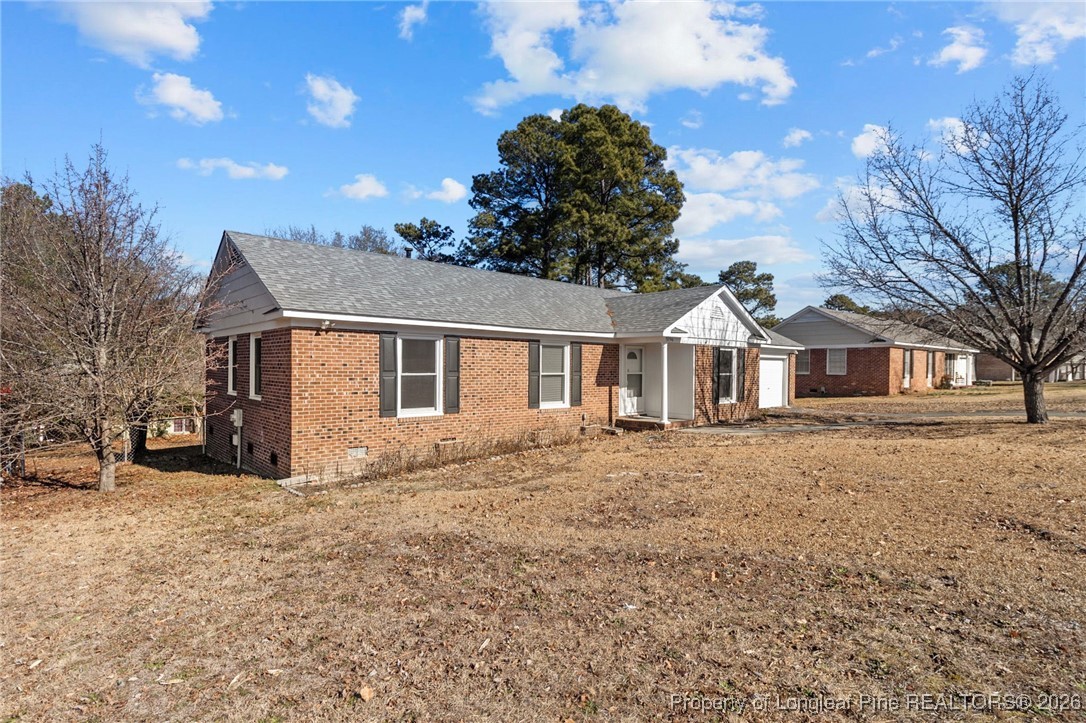 5196 Remington Road Fayetteville, NC 28311 - Photo 3 of 34 a front view of a house with a yard