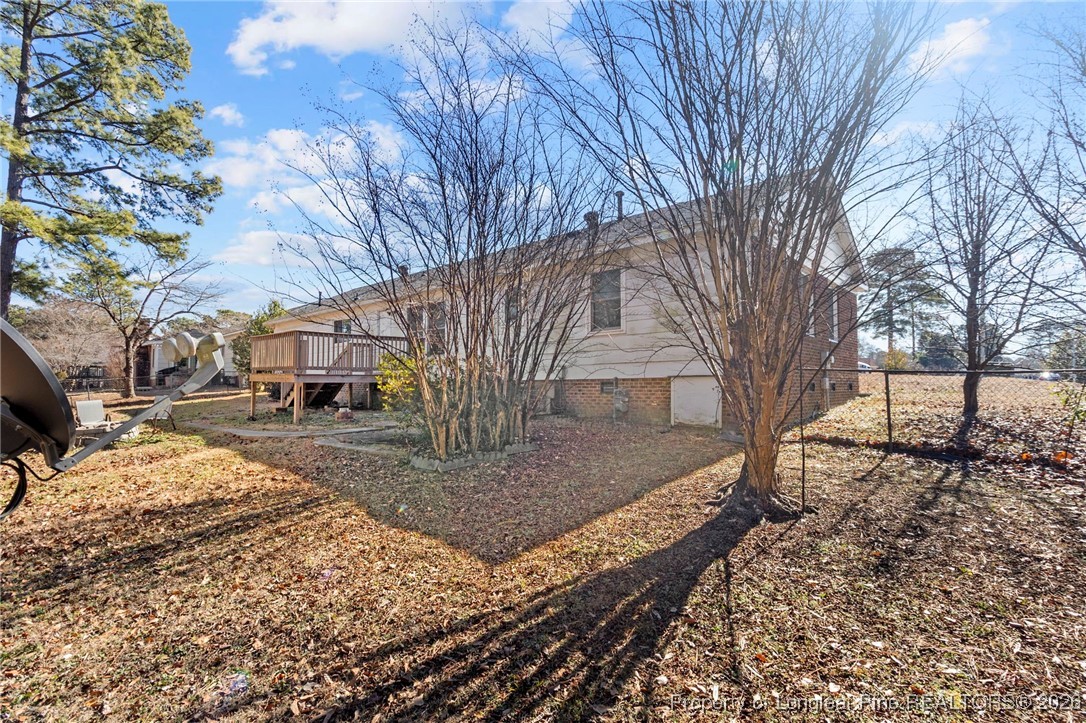 5196 Remington Road Fayetteville, NC 28311 - Photo 32 of 34 a view of a yard with a tree