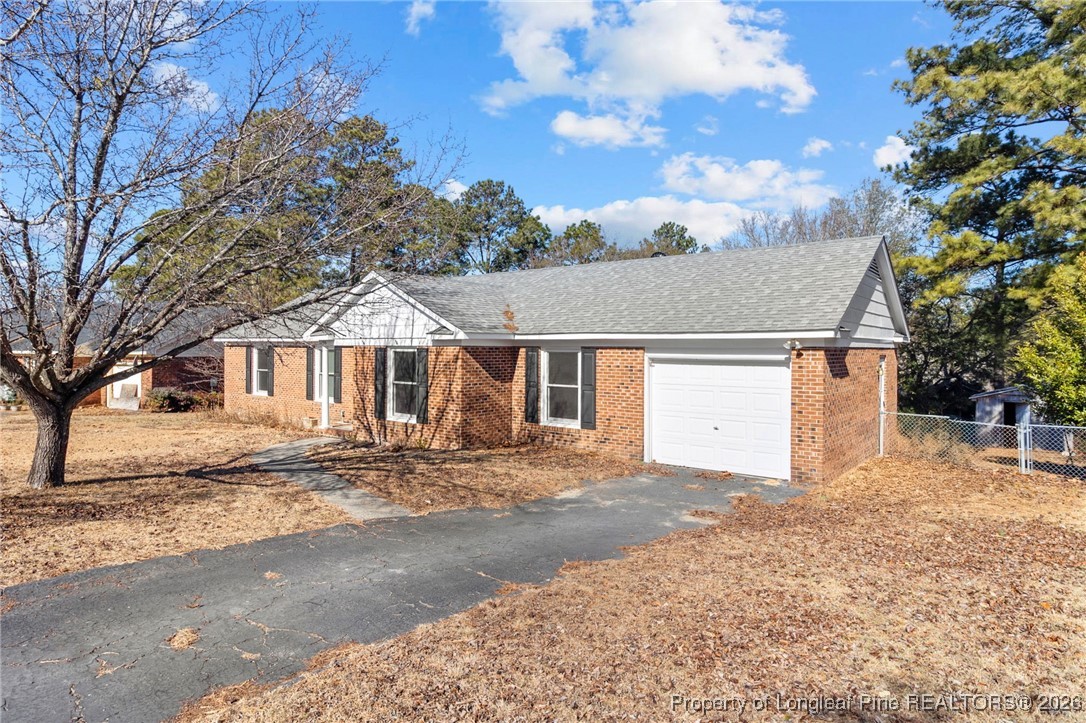 5196 Remington Road Fayetteville, NC 28311 - Photo 4 of 34 a front view of a house with a dirt yard