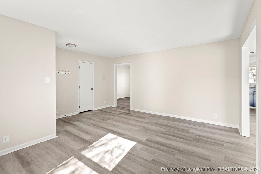 5196 Remington Road Fayetteville, NC 28311 - Photo 8 of 34 a view of an empty room and wooden floor