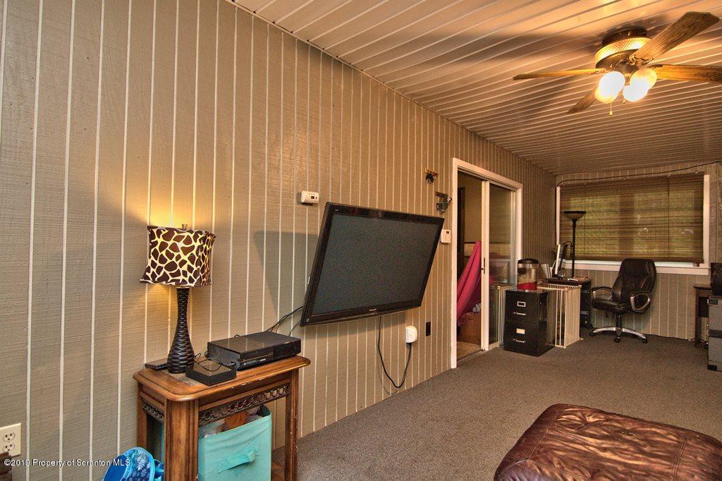 162 Highland Road Dalton, PA 18414 - Photo 19 of 44 a living room with furniture and a flat screen tv