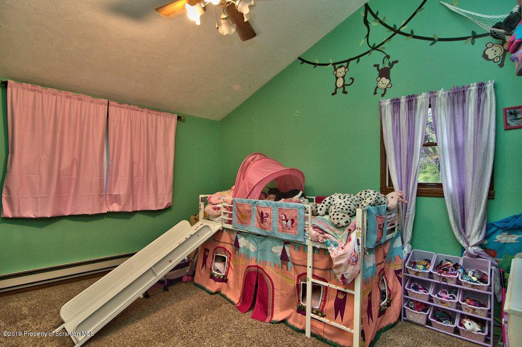 162 Highland Road Dalton, PA 18414 - Photo 21 of 44 a room with lots of trees and furniture