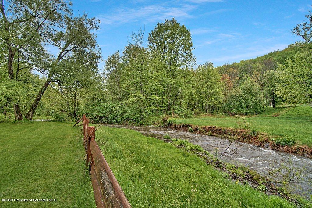 162 Highland Road Dalton, PA 18414 - Photo 28 of 44 a view of a garden with an outdoor space